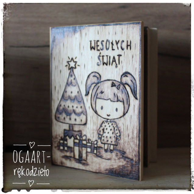Wooden box with Christmas graphics. A girl and a Christmas tree.