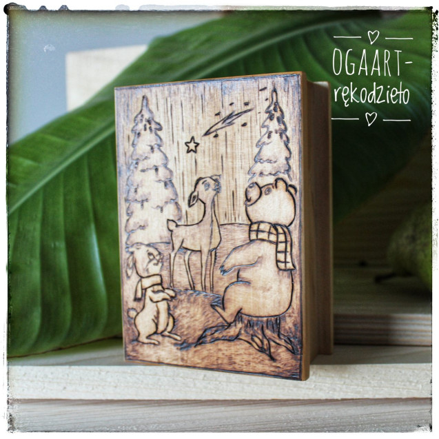 Wooden box with Christmas graphics, forest animals.
